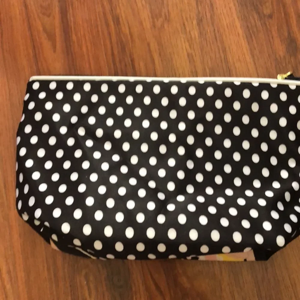 Estee Lauder Harpers Bizarre black and yellow cosmetic case.